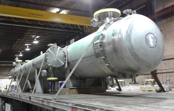 large refining stainless steel heat exchangers on a truck's flatbed